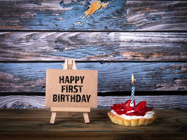 istock Happy First Birthday. Cake with candle 1177401112