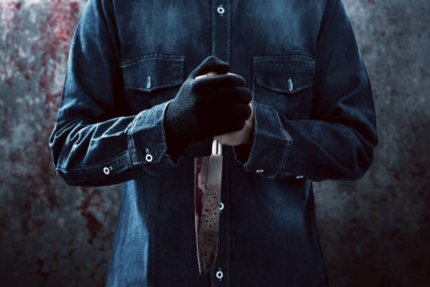 istock Killer with a bloody knife 1177401166