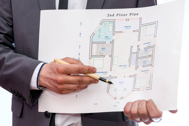 istock House plan with male hands isolated on white 1177401276