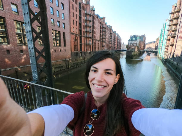 istock Woman making selfie in Hamburg old town 1177402784