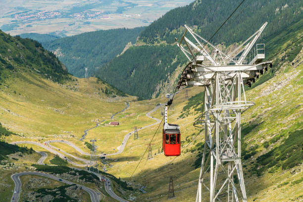 Red cabin of cable car to Balea Lake over the famous mountain Transfagarasan Road, Romania Cable car to Balea Lake over the famous mountain Transfagarasan Road in Romanian Carpathian Moutains balea lake romania stock pictures, royalty-free photos & images