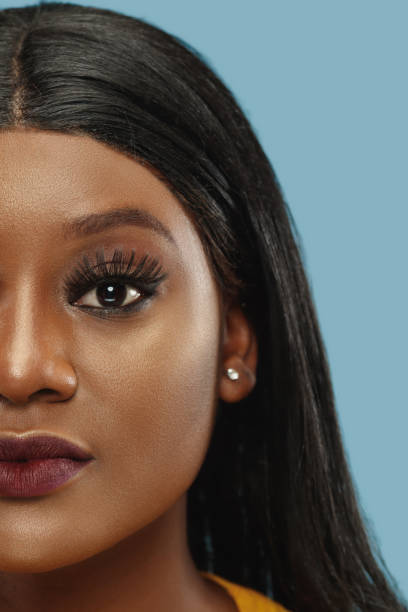 istock African-american young woman's close up portrait on studio background 1177403011
