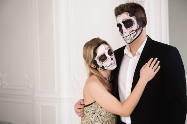 istock A couple with skeleton make up for Halloween or All Souls Day 1177404462