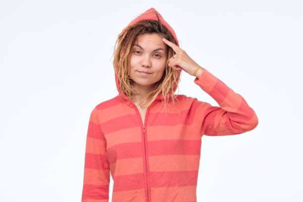 istock Ethnic young woman with dreadlocks in hood having a great idea 1177406091