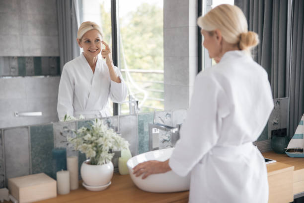 istock Positive delighted female person testing new cream 1177406212