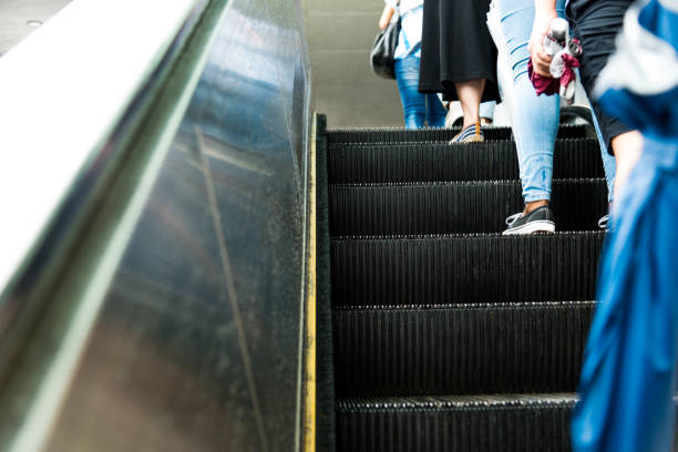 istock Group of people standing on escalator 1177406219