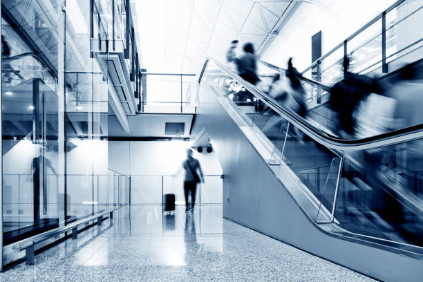 istock Group of people standing on escalator 1177406289