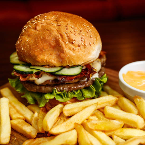 Delicious double cheeseburger with french fries at the pub