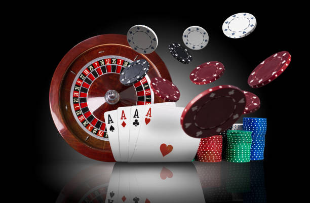 istock Four aces standing on mirror surface with backlight, ahead of brown roulette and multicolored chips in piles, some of them are flying apart. Close-up 1177406814
