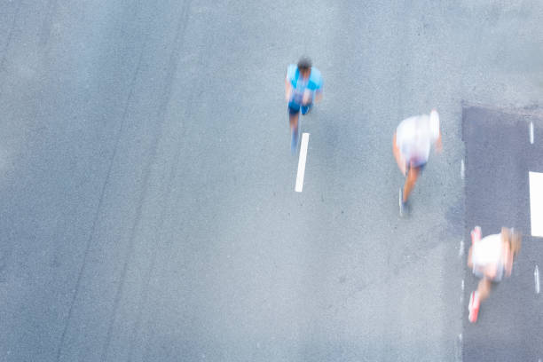 istock Athletes running on the city road 1177407445