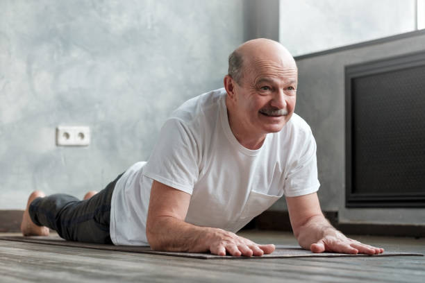 istock Senior hispanic man doing variation of cobra pose 1177408187
