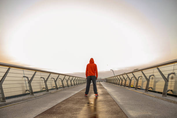 istock Caucasian athlete standing alone on a bridge 1177409444