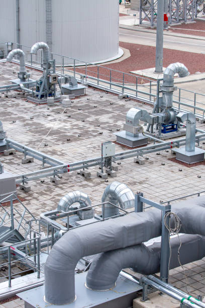 istock External infrastructure of the microclimate support system at a large industrial site. Air pipelines inlet and exhaust. Fans and air conditioning. Systems of control of pressure, humidity, temperature 1177409504