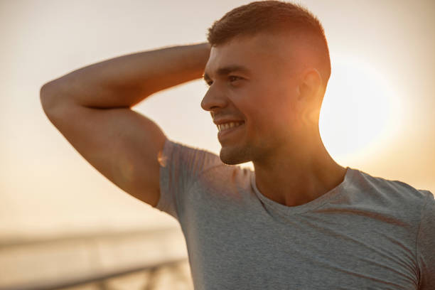 istock High-spirited athletic young man looking into the distance 1177412975