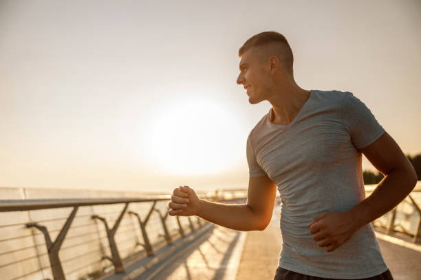 istock Pleasant sportive young man working out outside 1177413062