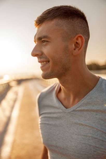 istock Smiling sportive young man looking into the distance 1177413075