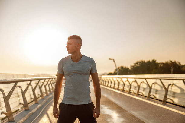 istock Attractive serious muscular young man looking away 1177413112