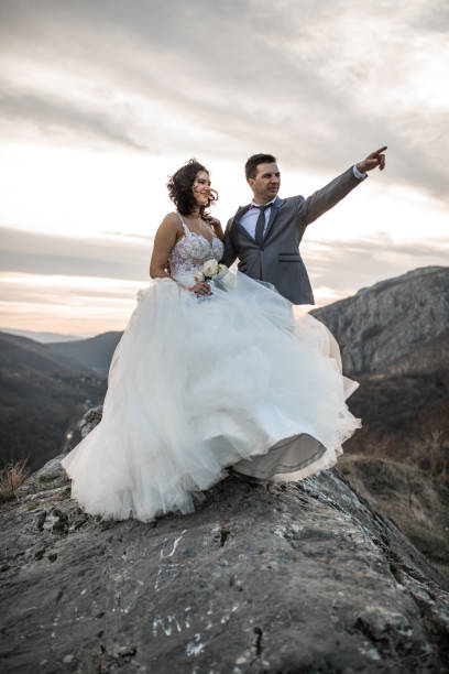 istock Young newlywed couple on mountain top 1177413748