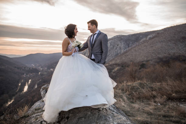istock Young newlywed couple on mountain 1177413770