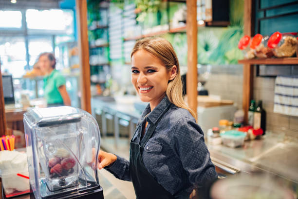 portrait of a charming smiling waitress working at small business shop. - 7585 imagens e fotografias de stock