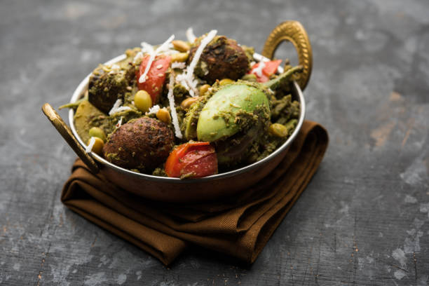 Undhiyu is a Gujarati mixed vegetable dish, specialty of Surat, India. Served in a bowl with or without poori