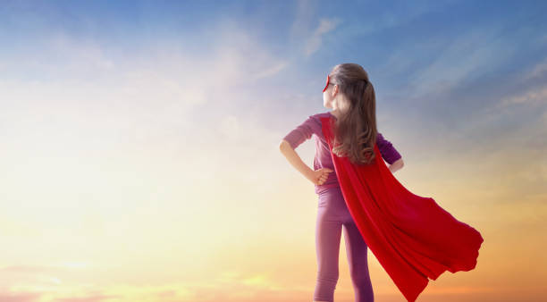 istock girl playing superhero 1177421284
