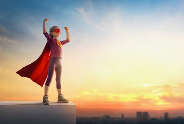 istock girl playing superhero 1177421301