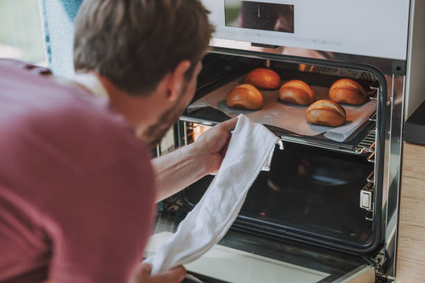 istock Cook looking at prepared pastry in oven 1177421755