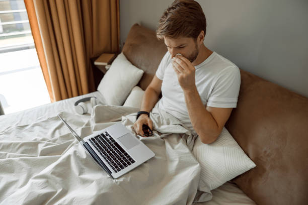 istock Man working remotely inspite of having cold 1177422098