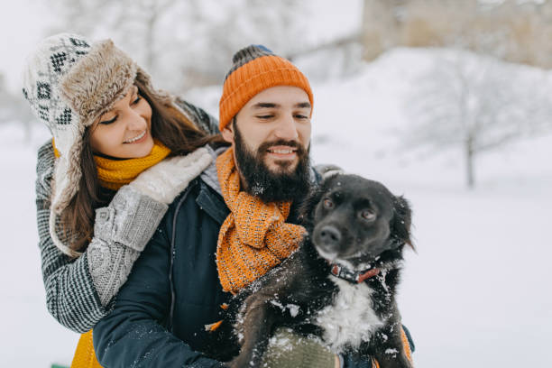 istock Happy young couple having fun in snow 1177423207