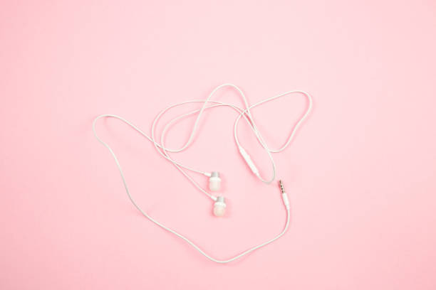 istock white wired headphones on pink isolated background. top view. flat lay. mockup 1177423350