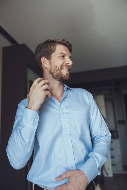 istock Cheerful man getting ready to go out 1177423793