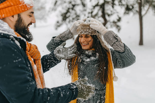 istock Couple in the snow playing 1177423958