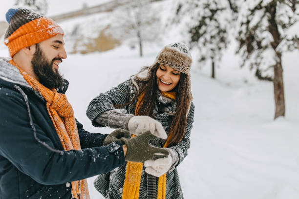 istock Couple in the snow playing 1177424586