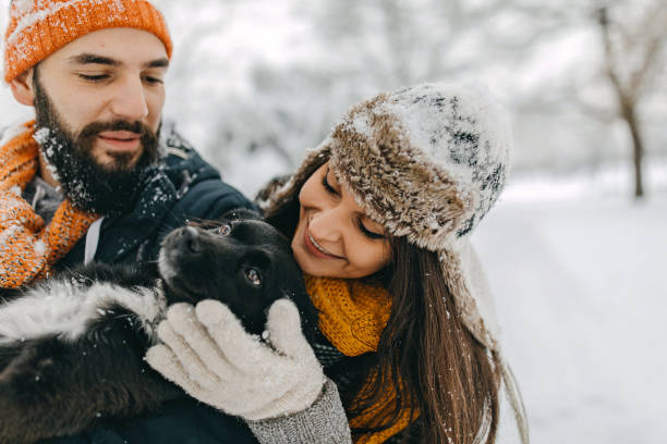 istock Happy young couple having fun in snow 1177424704