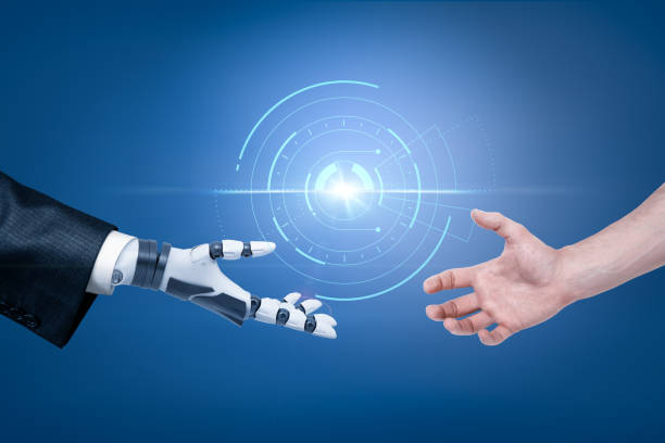 istock Robot's hand in suit and man's hand reaching out for handshake with spherical hologram object in the background. 1177427868