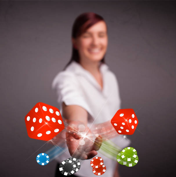 istock Young woman throwing dices and chips 1177428466