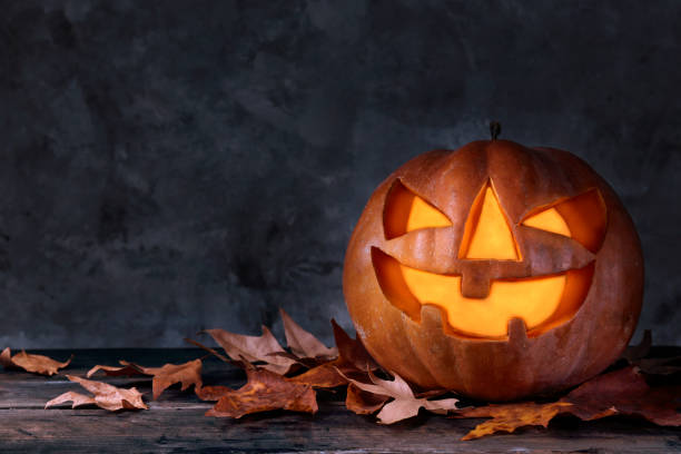 istock Jack-O-Lantern pumpking with light inside for all hallows eve. Halloween background. 1177428646