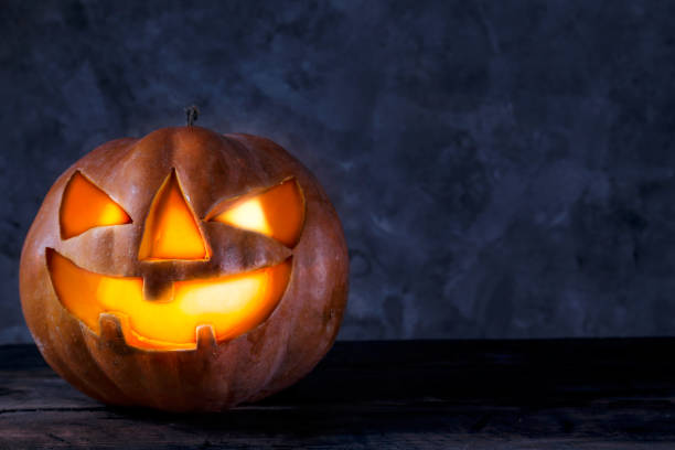 istock Jack-O-Lantern pumpking with light inside for all hallows eve. Halloween background. 1177428648