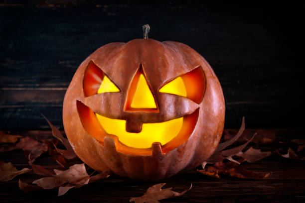 istock Jack-O-Lantern pumpking with light inside for all hallows eve. Halloween background. 1177428764