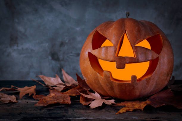 istock Jack-O-Lantern pumpking with light inside for all hallows eve. Halloween background. 1177429433