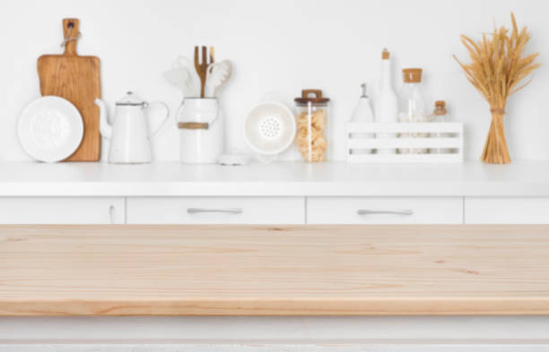 Blurred kitchen counter with utensils and ingredients over wooden table Blurred kitchen counter with utensils and ingredients over wooden table grain and cereal products stock pictures, royalty-free photos & images