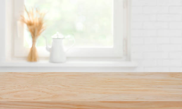 istock Defocused kitchen window sill background over wooden texture board 1177430641