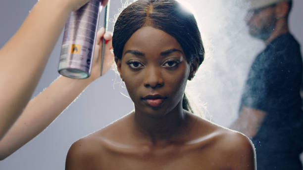 istock African model photoshoot. Hair touch ups 1177430949