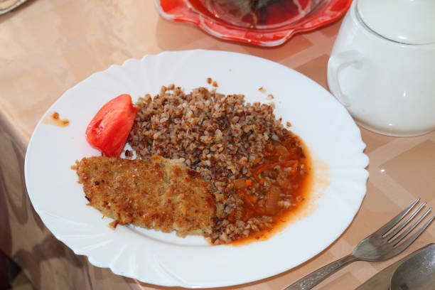 istock Buckwheat porridge with cutlet and tomato 1177432337
