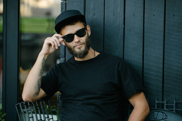 istock Stylish handsome man wearing sunglassesand smiling 1177432985