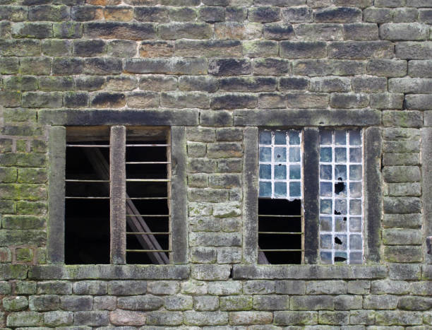 istock broken windows in an old derelict stone house 1177436376
