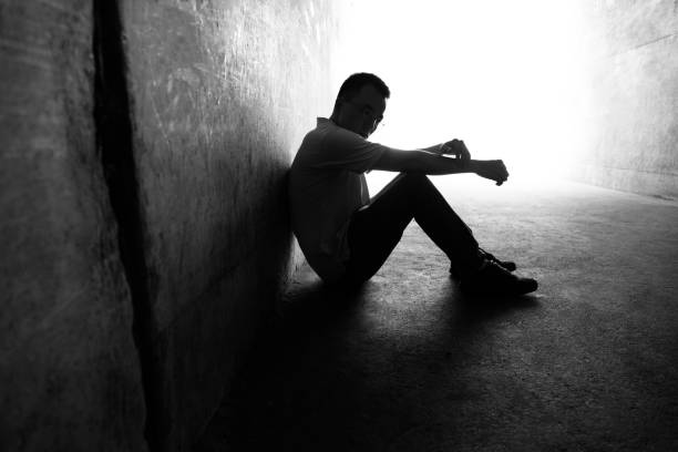 istock Desperate man sitting in the tunnel 1177436379