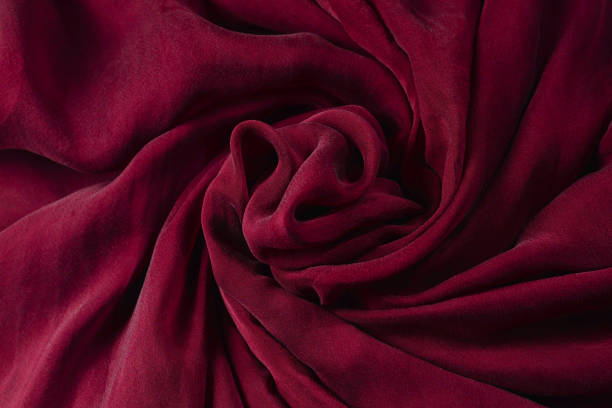 istock Soft smooth burgundy silk fabric background. Fabric texture. 1177436602
