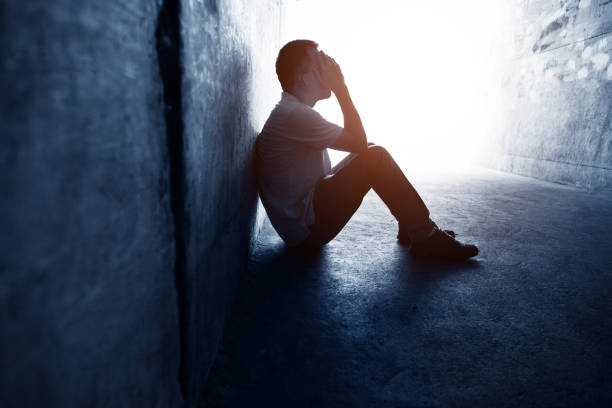 istock Desperate man sitting in the tunnel 1177437574